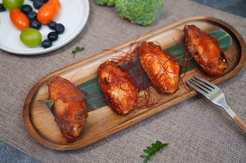 Ghost pepper extra hot wings with warning label