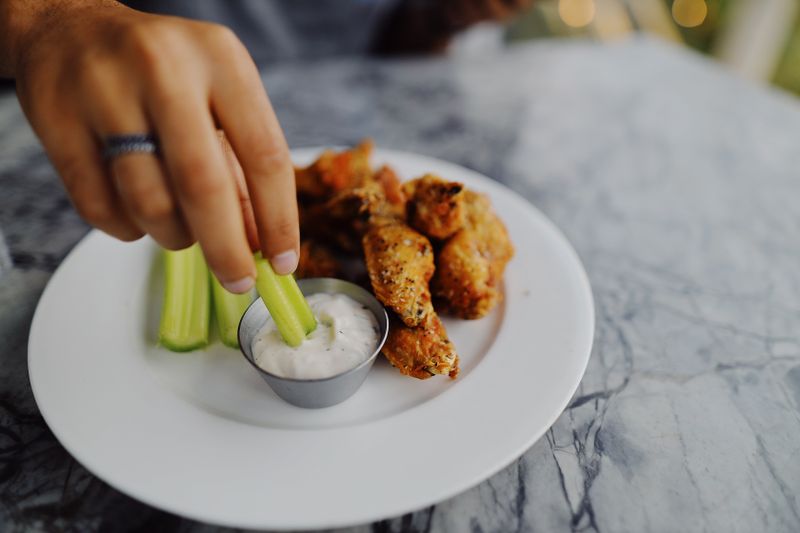 Wing Snob classic bone-in wings tossed in buffalo sauce